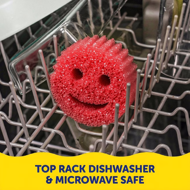 Image Description: A red Scrub Daddy sponge resting on the grey tines of a dishwasher rack. A yellow banner at the bottom contains dark blue text that reads, "TOP RACK DISHWASHER & MICROWAVE SAFE"