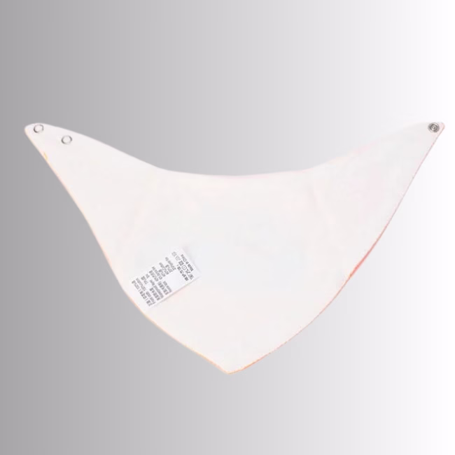 Image Description: A promotional product image showing the reverse side of a baby bib set against a neutral gradient background, highlighting the white fabric backing, snap button closures on the corners, and a stitched product care and material tag.