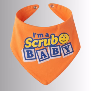 Image Description: A promotional product hero image of an orange bandana-style baby bib set against a neutral gradient background, featuring the blue and yellow text "I'm a Scrub Baby" alongside a smiley-face icon.