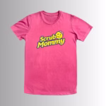 mage Description: A promotional product hero image of the front of a vibrant pink short-sleeve t-shirt set against a neutral gradient background, featuring the yellow and blue "Scrub Mommy" logo with a pink bow graphic printed across the chest.