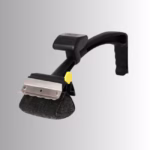 Image Description: A promotional product hero image of the main black BBQ Daddy grill brush set against a neutral gradient background, showcasing its ergonomic handle, a stainless steel scraper blade, and a textured bristle-free scrubbing head with a yellow smiley-face release clip.