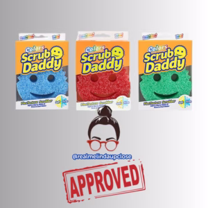 Image Description: A promotional product bundle hero image featuring three boxed Scrub Daddy Colors sponges in blue, red, and green arranged in a row above an approved creator stamp graphic.