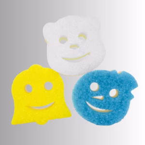 Image Description: Three winter-themed Scrub Daddy and Scrub Mommy sponges arranged against a neutral gradient background, featuring a large white polar bear sponge positioned at the top, a yellow bell-shaped sponge on the bottom left, and a blue textured snowman sponge on the bottom right, each with a smiling face cutout.