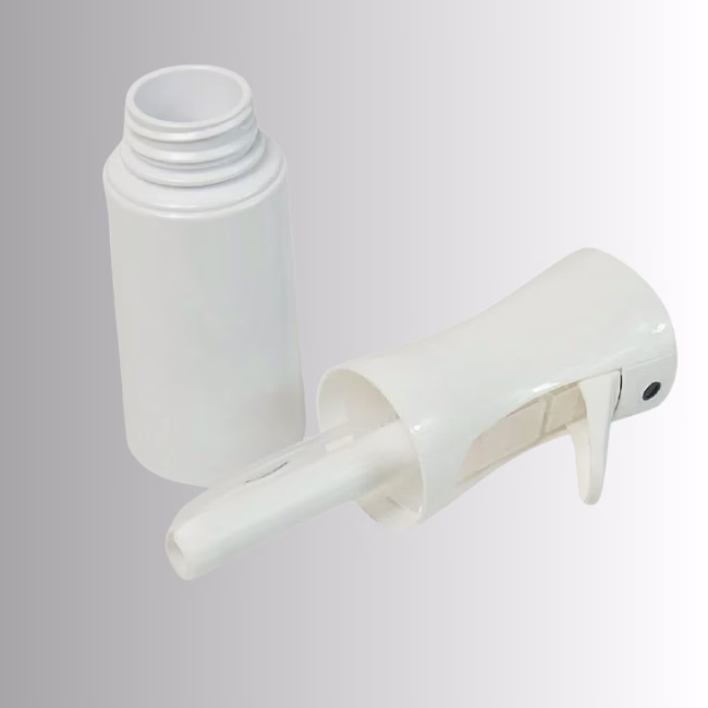 Image Description: A product detail shot showing the white continuous spray bottle with its trigger pump head detached, revealing the threaded neck and dip tube against a neutral gradient background.
