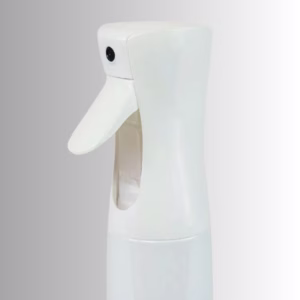 Image Description: A close-up product side view of the white continuous spray bottle set against a neutral gradient background, emphasizing the ergonomic trigger handle and nozzle design.
