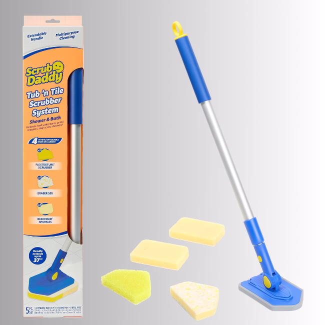 Image Description: A promotional product bundle hero image set against a neutral gradient background, showcasing the Scrub Daddy Tub 'n Tile Scrubber System box on the left alongside its contents on the right, which include an extendable long-handled blue and silver scrubber tool and four interchangeable cleaning pads.