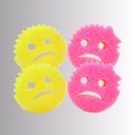 Image Description: A promotional product bundle hero image set against a neutral gradient background, showcasing a 4-pack of dual-colored Cranky Couple scrub sponges featuring two yellow and two pink sponges with frowning facial expressions.
