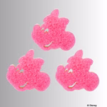 Image Description: Three pink, textured Minnie Mouse-shaped Scrub Mommy sponges arranged outside of their packaging against a neutral background, with one sponge positioned at the top and two side-by-side below. © Disney