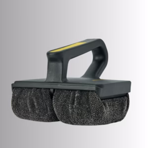 Image Description: A promotional product hero image set against a neutral gradient background, showcasing a black Scrub Daddy Griddle Daddy cleaning tool featuring an ergonomic handle with yellow detailing and dual textured scrubbing pads underneath.