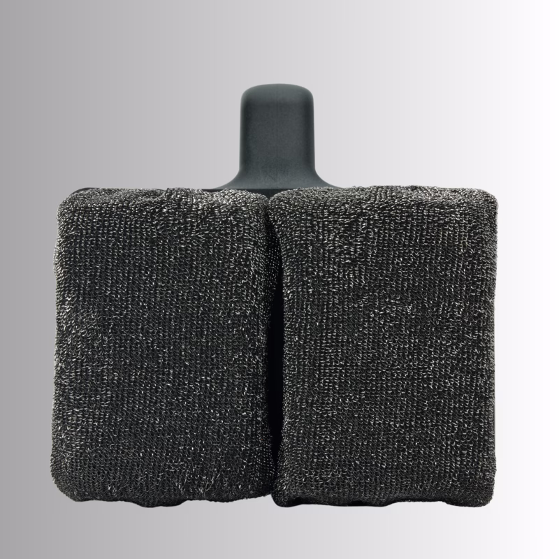 Image Description: Scrub Daddy BBQ Daddy Bristle-Free Griddle Scrubber shown from a front-facing perspective against a gradient grey background, highlighting the dual textured black ArmorTec mesh scrubbing pads.