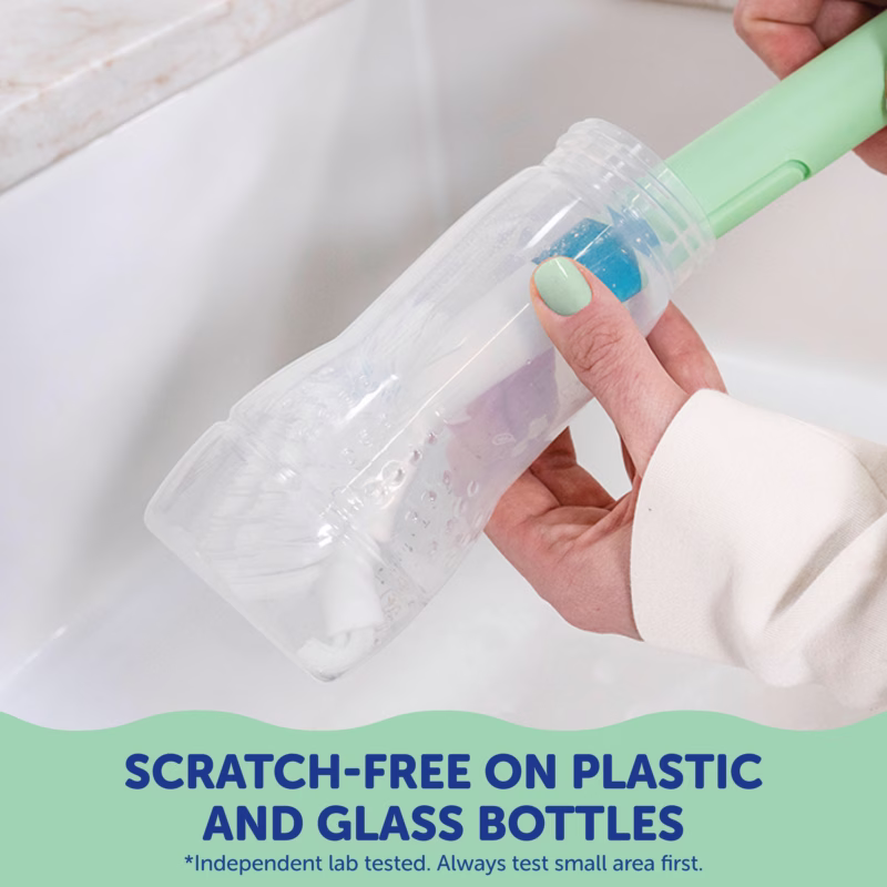 Image Description: A feature demonstration photo showing the brush cleaning safely inside a plastic bottle over a sink.
