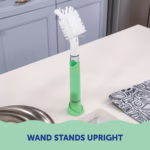 Image Description: A product lifestyle photo showing the Scrub Baby wand standing upright on a kitchen countertop.