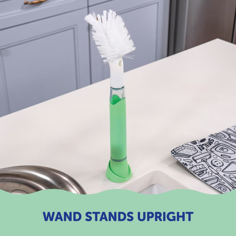 Image Description: A product lifestyle photo showing the Scrub Baby wand standing upright on a kitchen countertop.