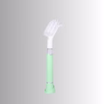 Image Description: A promotional product side image of the Scrub Baby bristle brush set against a neutral gradient background, featuring a light green and white soap-dispensing wand with a white bristle head.