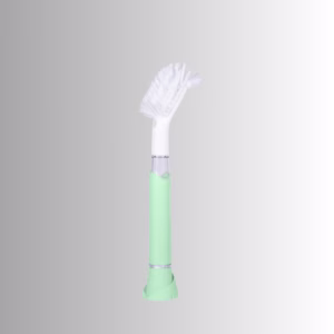 Image Description: A promotional product side image of the Scrub Baby bristle brush set against a neutral gradient background, featuring a light green and white soap-dispensing wand with a white bristle head.