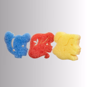 Image Description: A promotional product hero image of three special edition Disney Princess Scrub Mommy dual-sided sponges in blue, red, and yellow, shaped like character silhouettes and set against a neutral gradient background.